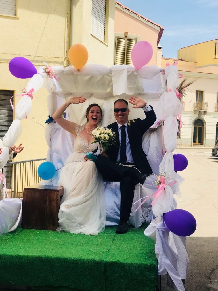 Our wonderful wedding day in May 2018 when our friends stuck us on the back of a truck and drove us around the whole town!